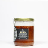 Miel de abeja Premium elaborada de forma artesanal adicionada con una mezcla de chiles secos naturales.